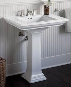 Pedestal Sink with beadboard in white bathroom
